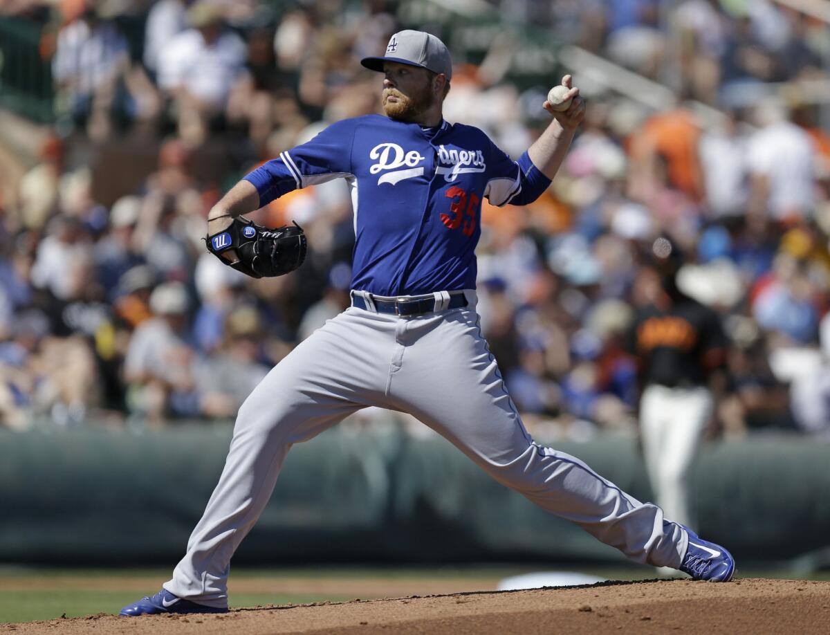 Dodgers left-handed pitcher Brett Anderson delivers a pitch in the first inning of a spring training exhibition game.