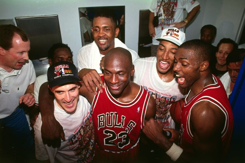 A photographed featured in "The Last Dance." INGLEWOOD, CA- JUNE 12: Michael Jordan #23 of the Chicago Bulls celebrates following Game Five of the 1991 NBA Finals on June 12, 1991 at the Great Western Forum in Inglewood, California. NOTE TO USER: User expressly acknowledges and agrees that, by downloading and/or using this Photograph, user is consenting to the terms and conditions of the Getty Images License Agreement. Mandatory Copyright Notice: Copyright 1991 NBAE (Photo by Andrew D. Bernstein/NBAE via Getty Images)