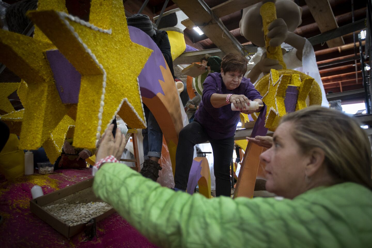 Jan Barham and Claire Glidden work on the Honda float