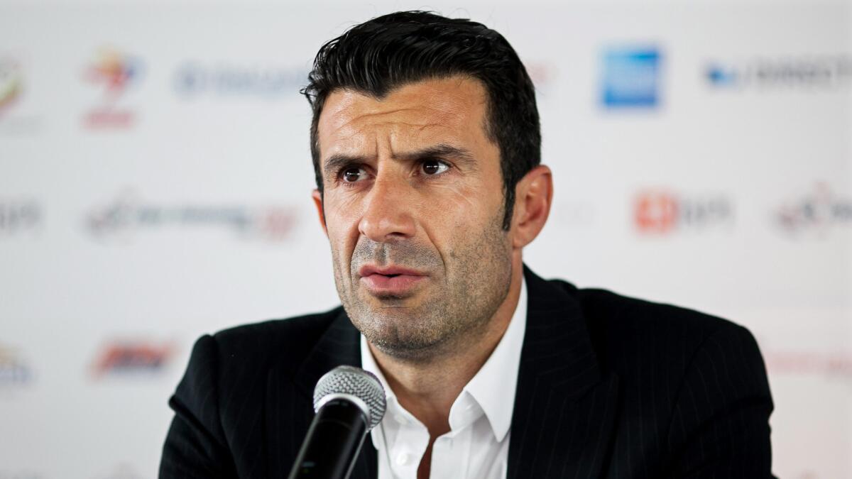 Former Portuguese soccer player Luis Figo speaks during a news conference in June 2013. Figo announced Wednesday that he will run for the FIFA presidency.