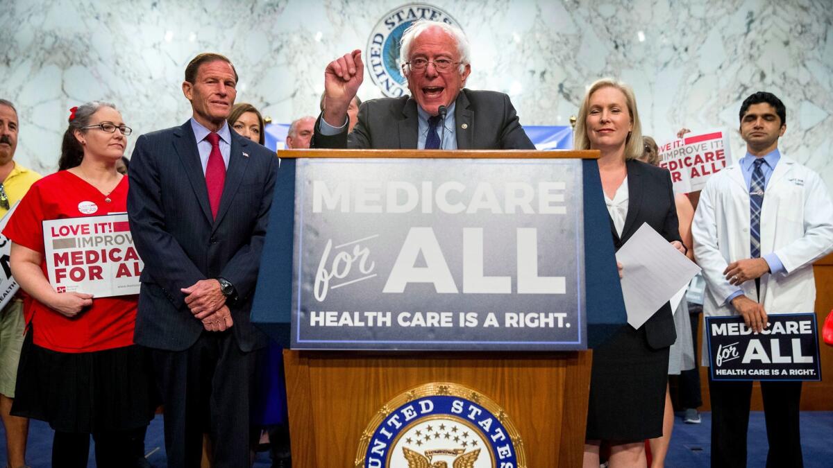 Sen. Bernie Sanders (I-Vt.), center, speaks at a news conference on Sept. 13 on Capitol Hill in Washington to unveil his Medicare for All legislation to reform healthcare.