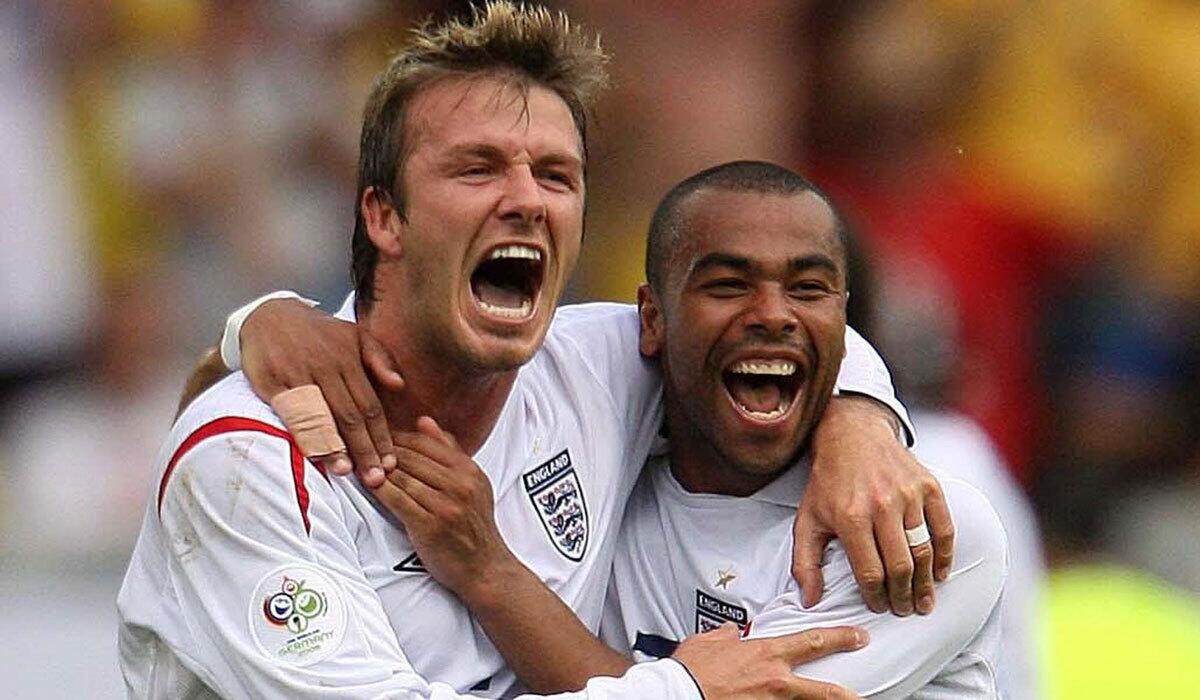 Ashley Cole, right, celebrates with David Beckham after Beckham scored for England in a 2006 World Cup match against Ecuador.