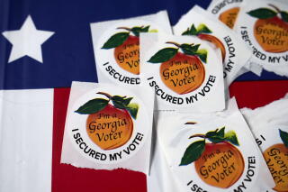 Stickers sit on a table inside a polling place in Atlanta.