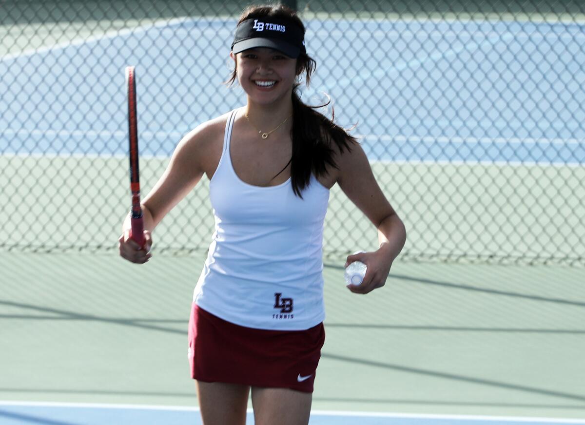Laguna Beach's Hannah Nguyen is all smiles after winning her final set in the Division 2 title match on Friday.