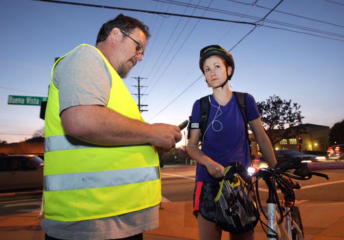 Rebecca Damodaran answers survey questions for Walk Bike Burbank chairman Mike Hollis during Operation Firefly.