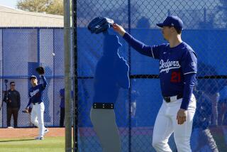 Goodyear, Arizona, Wednesday, February 14, 2024 - Los Angeles Dodgers' Walker Buehler looks on.