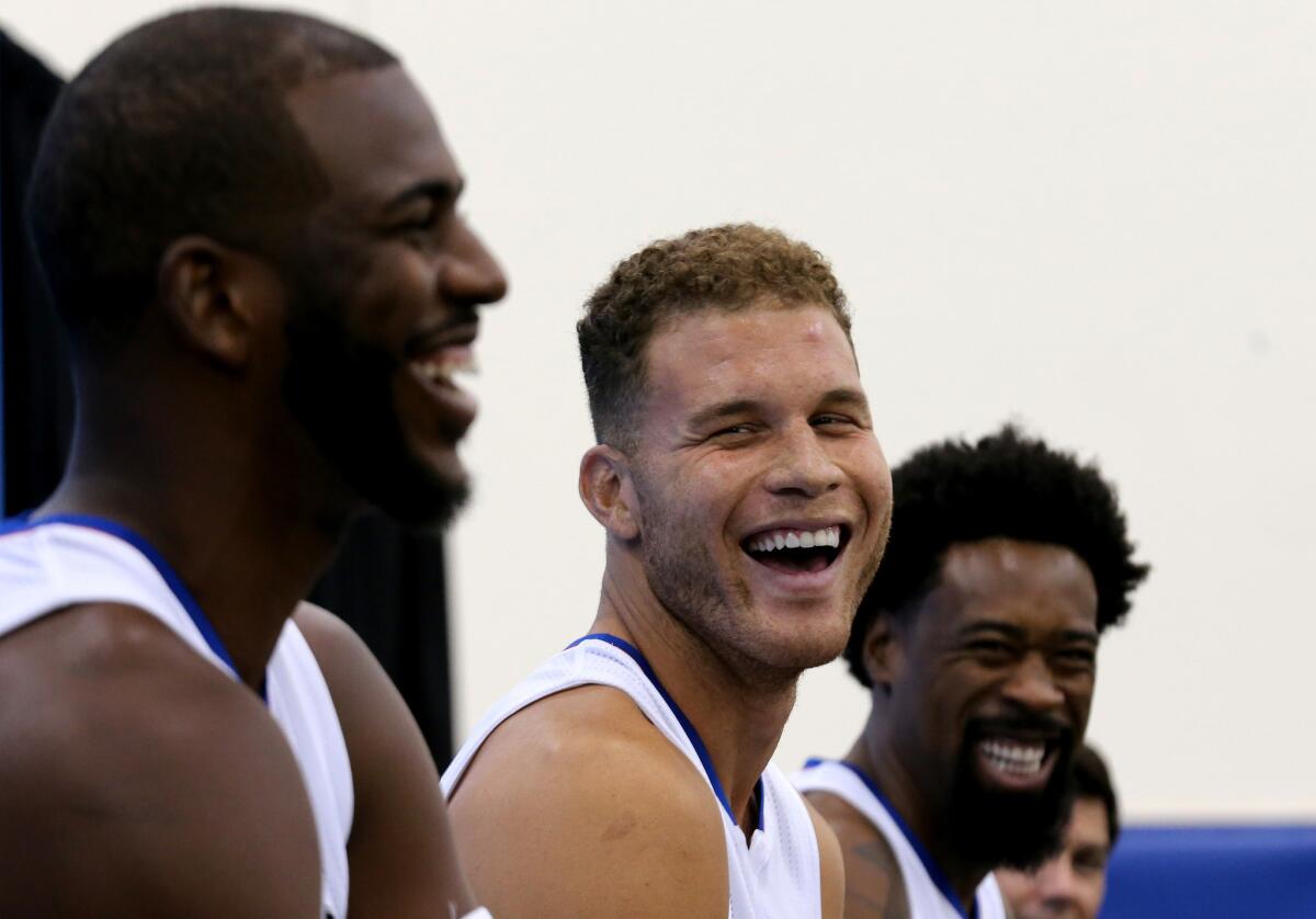 Clippers starters Chris Paul, left, Blake Griffin and DeAndre Jordan share a light moment while talking with reporters on media day on Sept. 25, 2015.