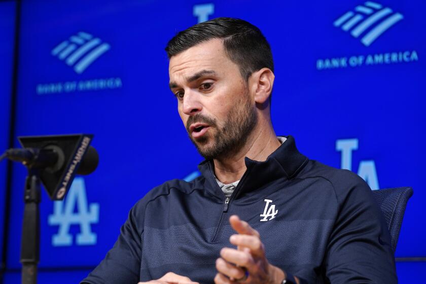 Los Angeles Dodgers General Manager Brandon Gomes speaks during a baseball news.