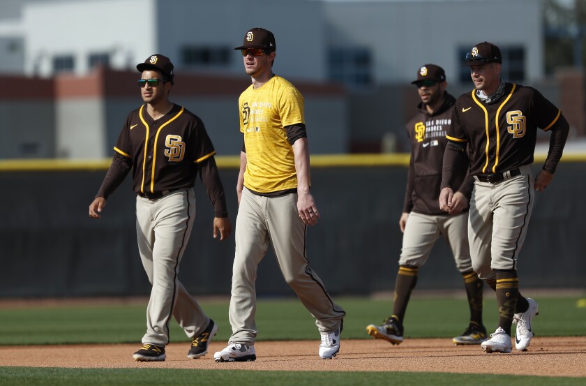 Padres outfielders Trent Grisham, left, Wil Myers, Tommy Pham and Brian O'Grady
