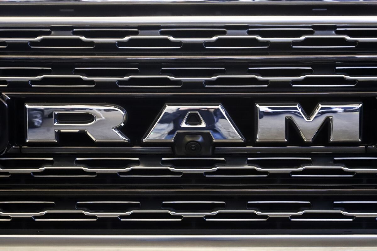 FILE - This Feb. 14, 2019, file photo shows the Ram logo at the 2019 Pittsburgh International Auto Show in Pittsburgh. Stellantis is recalling nearly 202,000 Ram heavy-duty pickups and chassis cabs to tighten a loose nut that can stop the windshield wipers from working properly. The recall, Thursday, Feb. 3, 2022, covers certain Ram 2500 and 3500 pickups and some 3500, 4500 and 5500 chassis cabs. They're all from 2019 and 2020, and most are in the U.S. and Canada. (AP Photo/Gene J. Puskar, File)