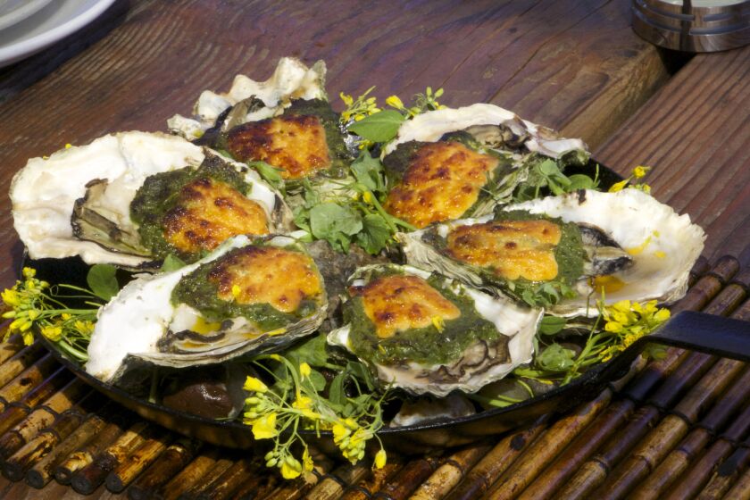 Local Oregon oysters, grilled with cheese and spinach from the Schooner in Tillamook, Ore.