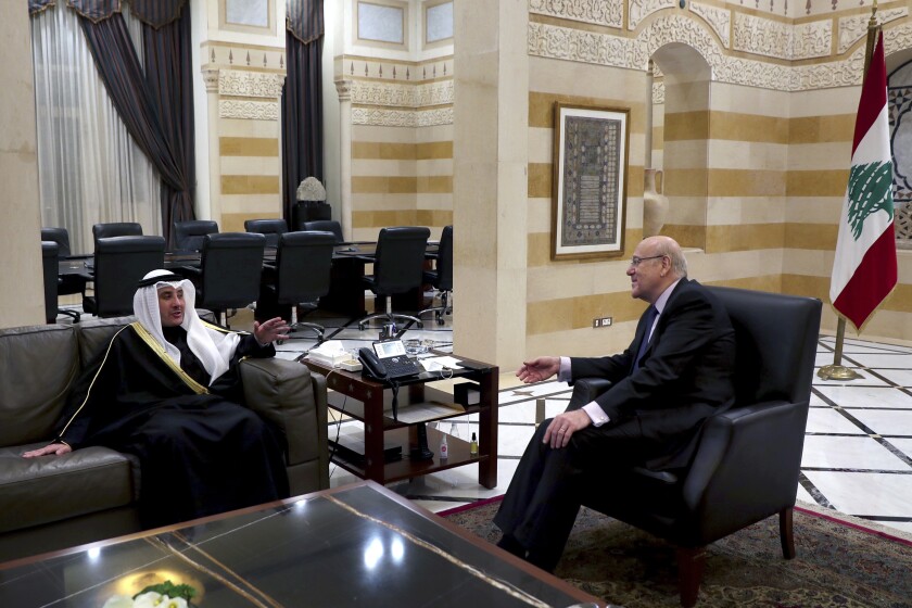 Lebanese Prime Minister Najib Mikati, right, meets with Kuwaiti Foreign Minister Sheikh Ahmad Nasser al-Mohammad al-Sabah in Beirut, Lebanon, Saturday, Jan. 22, 2022. (AP Photo/Bilal Hussein)