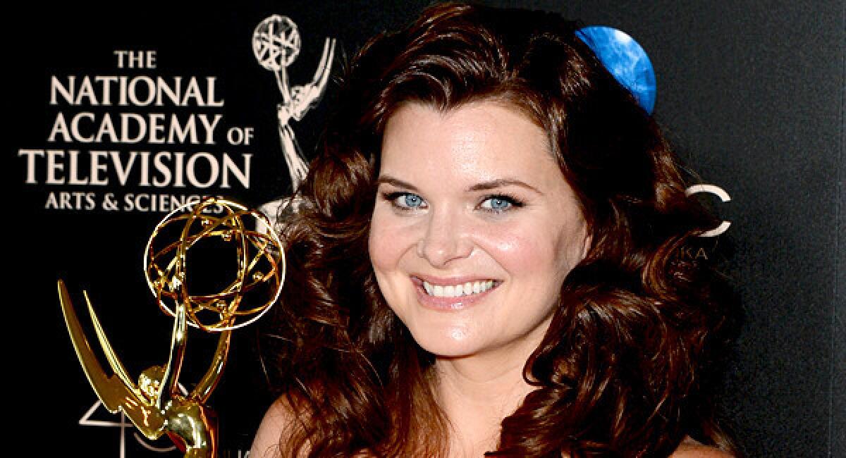 Actress Heather Tom poses with the lead actress in a drama series award for "The Bold and the Beautiful."