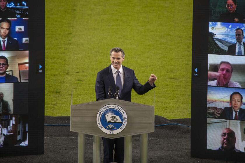 LOS ANGELES CA - March 09: Gov. Gavin Newsom delivers his third State of the State address to the Legislature and public virtually from en empty Dodger Stadium in Los Angeles Tuesday, March 9, 2021. There is no in-person audience at the outdoor location and public health guidelines are strictly observed. Photo taken at Dodger Stadium on Tuesday, March 9, 2021 in Los Angeles, CA. (Allen J. Schaben / Los Angeles Times)