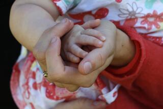 In this May 29, 2020, photo, Sara Adelman holds her daughter Amelia's hand at their home in Salt Lake City. Adelman is burning through her vacation time to help manage her current status as a working-from-home mom since her daughter's daycare closed due to the coronavirus pandemic. (AP Photo/Rick Bowmer)