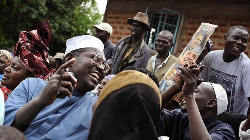 Malik Obama, half-brother of Barack Obama, sings in celebration with his family after the U.S. election results are announced in 2008.