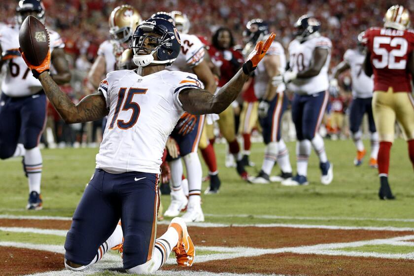 Bears wide receiver Brandon Marshall (15) celebrates after catching a five-yard touchdown pass against the 49ers in the fourth quarter Sunday night in San Francisco.