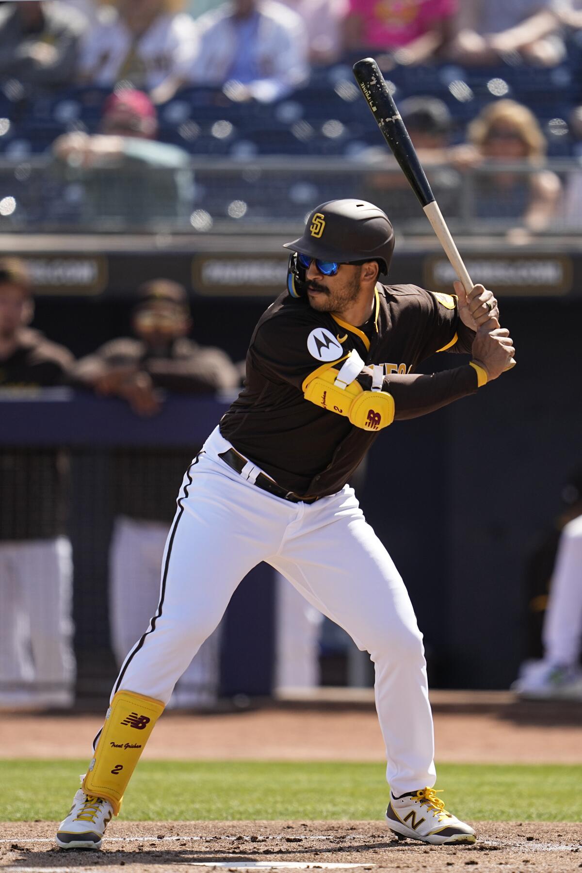 Trent Grisham bats for the Padres during a spring training game against the Reds on March 8.