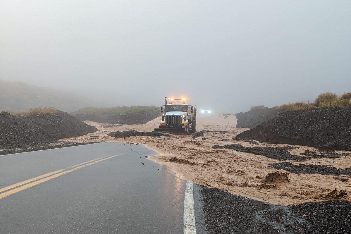 Rocks, mud and floodwater being cleared from highway 190.