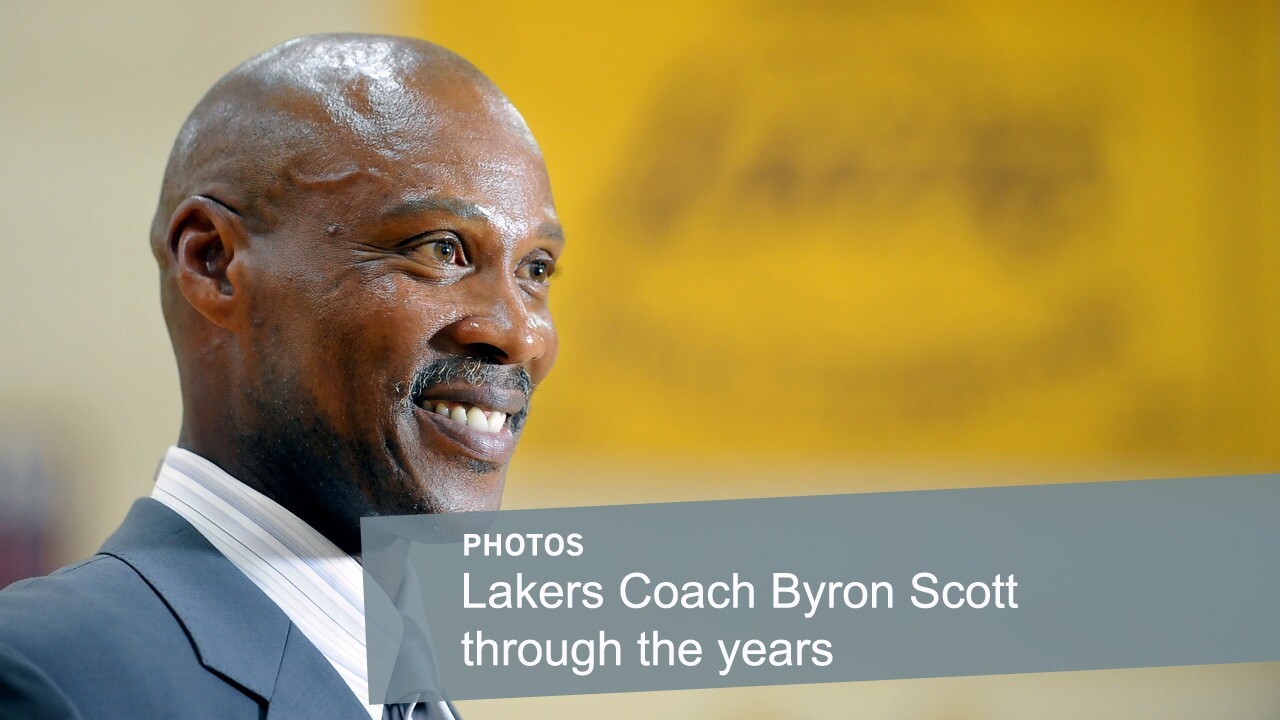 Lakers Coach Byron Scott smiles during his introductory news conference on July 29 at the team's training facility in El Segundo. Scott played for the Lakers for 11 seasons in the 1980s and '90s before returning this year to coach the team.