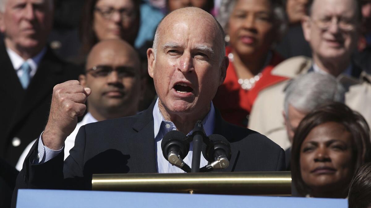 Gov. Jerry Brown speaks during a healthcare rally hosted by top Democrats on Wednesday on the steps of the U.S. Capitol.