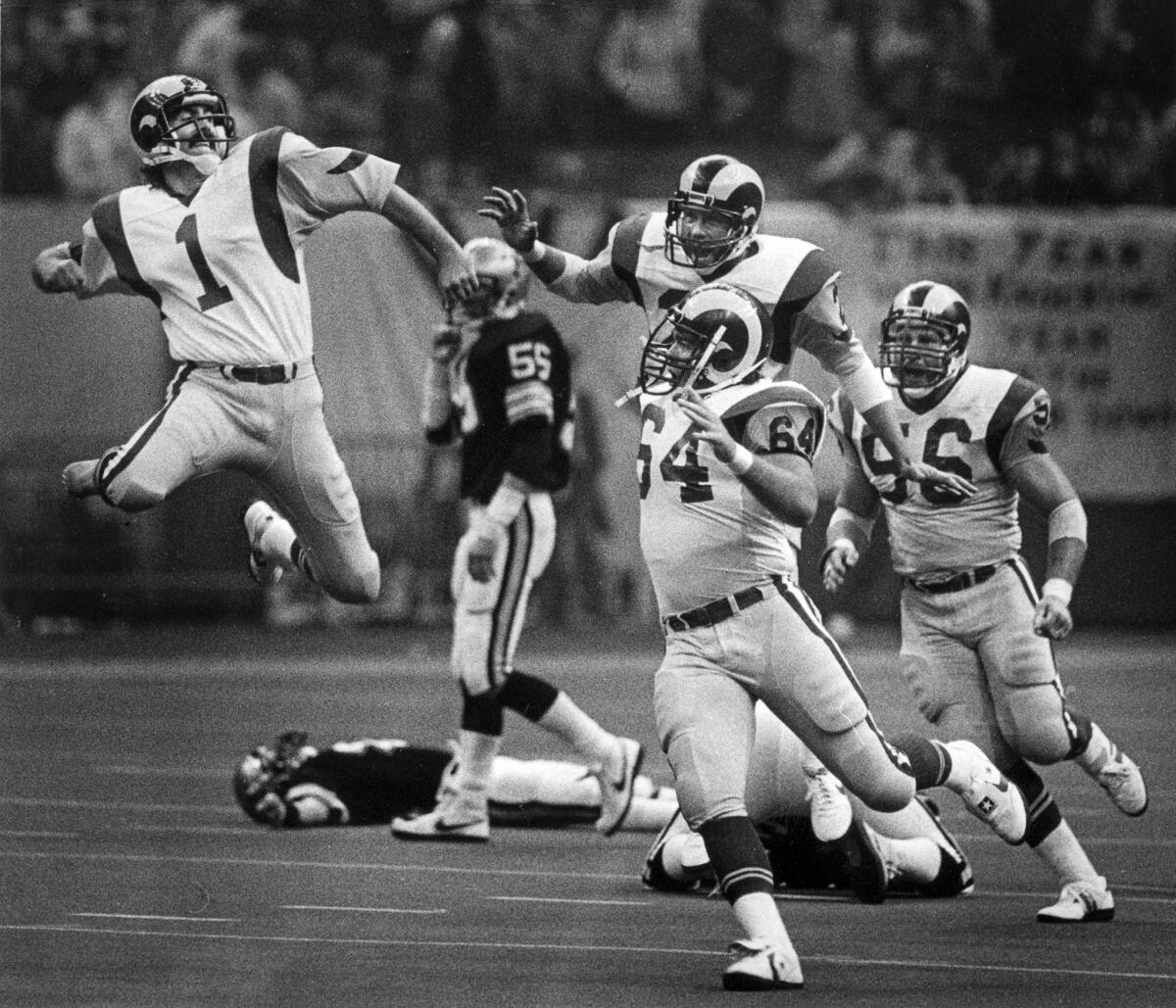 Dec. 18, 1983: The Rams' Mike Lansford, left, celebrates after kicking a game-winning field goal against the New Orleans Saints and getting Los Angeles into the NFC playoffs.