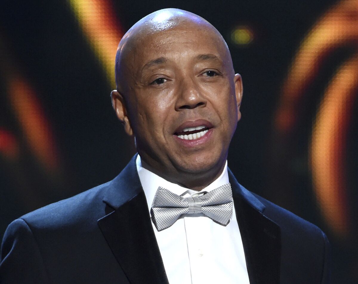 Hip-hop mogul Russell Simmons, seen here at the NAACP Image Awards in 2015, announced Thursday morning that he would be stepping down from his companies.