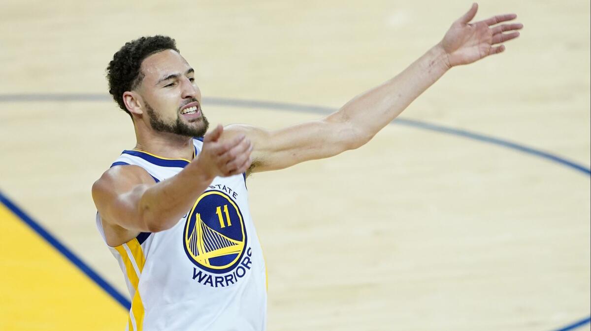 Golden State Warriors standout Klay Thompson celebrates after dunking during Game 1 of the NBA Western Conference semifinals against the Portland Trail Blazers on May 14.