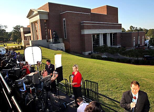 Members of the media report from outside of the Gertrude Castellow Ford Center at the University of Mississippi before the start of Friday's presidential debate between Democrat Barack Obama and Republican John McCain.