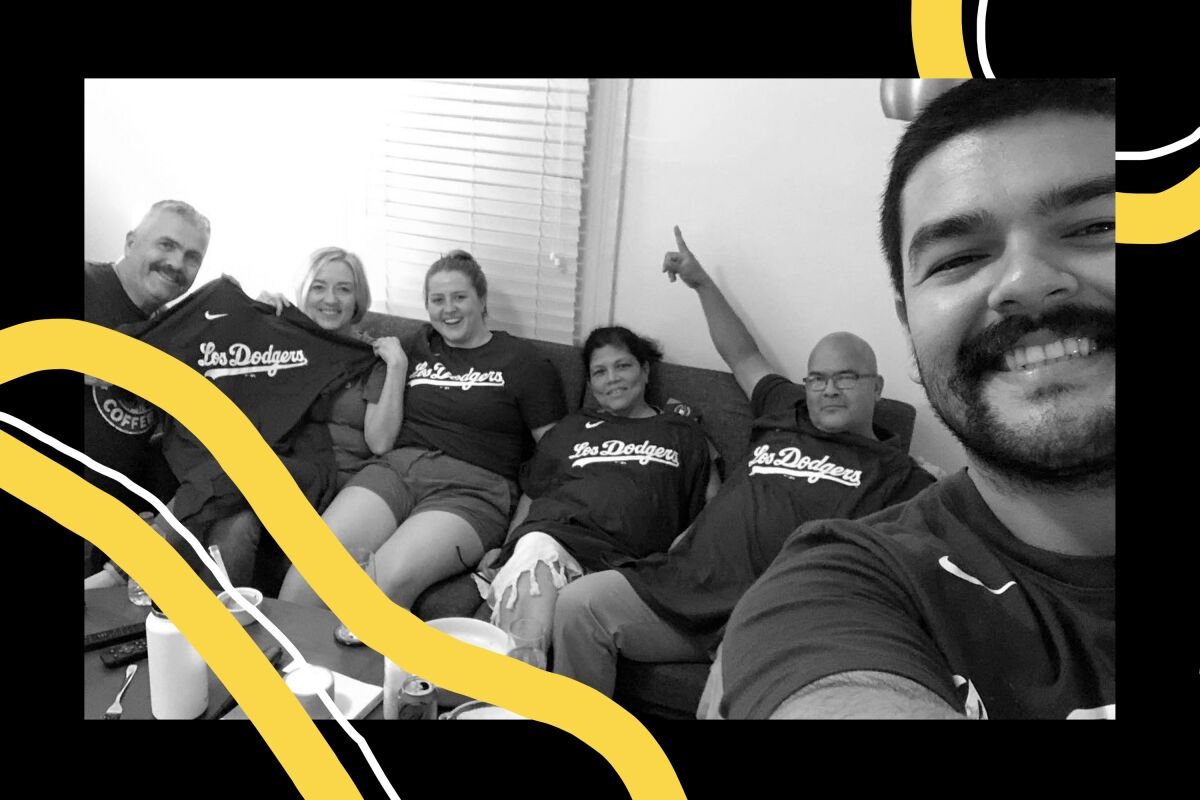 Salvador Blanco takes a selfie with his parents and in-laws wearing dodger shirts