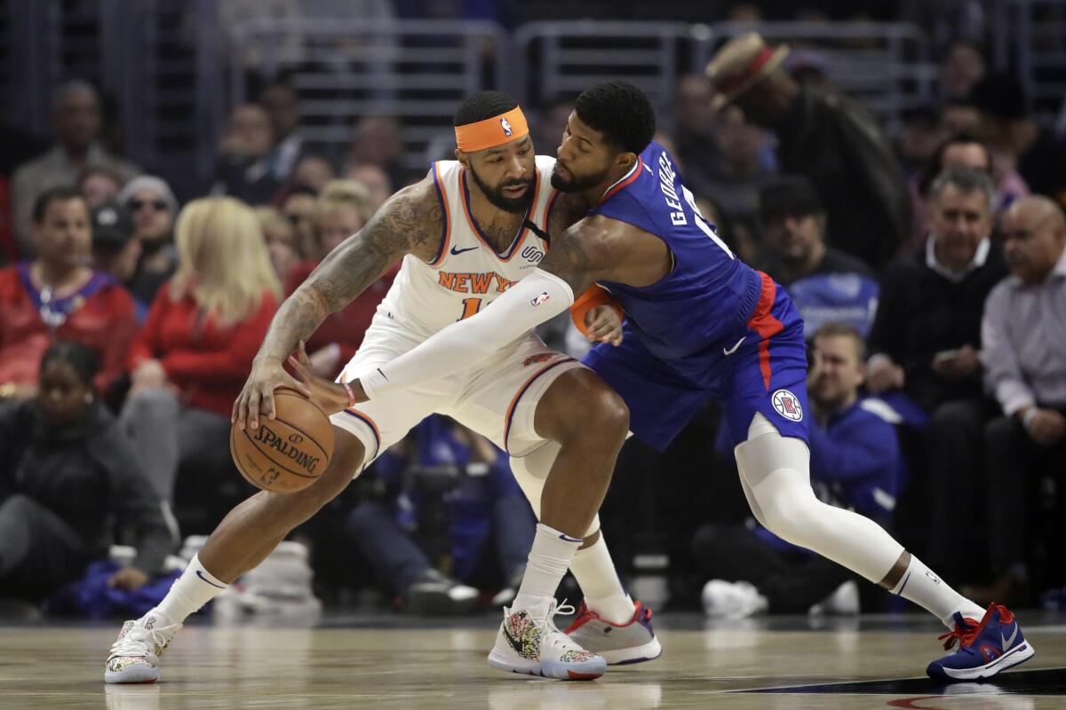 Paul George defends New York Knicks' Marcus Morris Sr.  