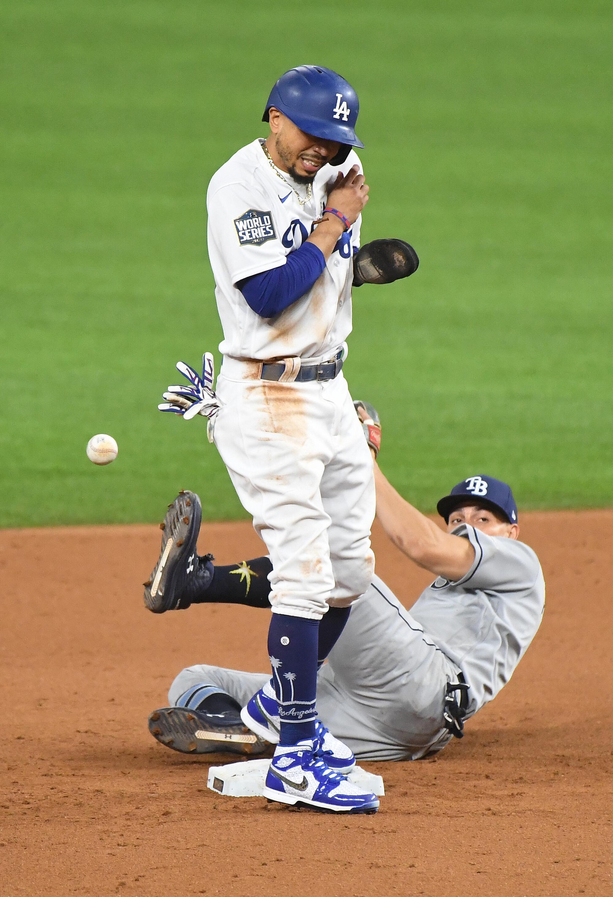 Dodgers baserunner Mookie Betts collides with Tampa Bay Rays shortstop Willy Adames after reaching second base.
