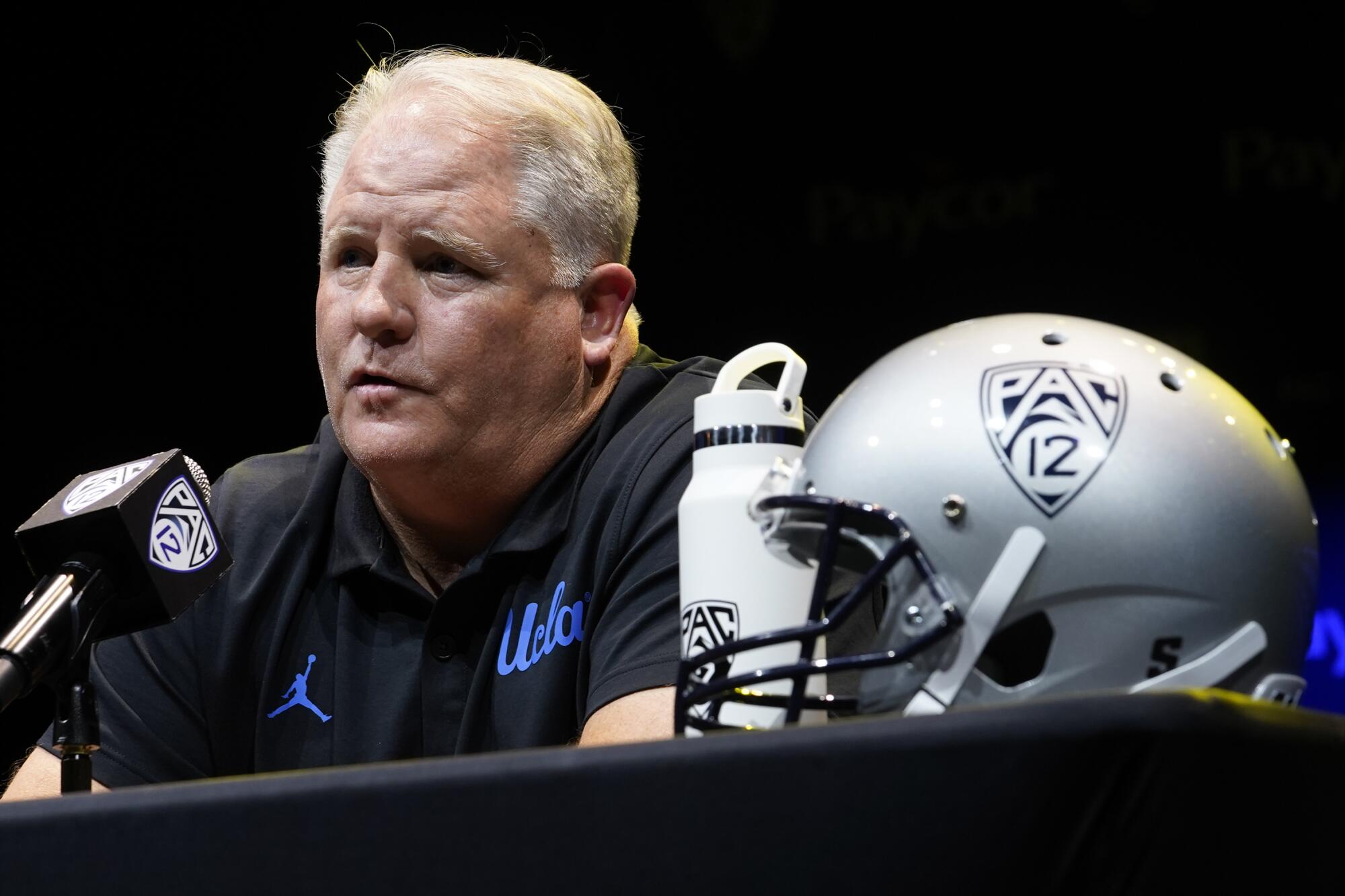 UCLA coach Chip Kelly speaks during Pac-12 media day in July 2022. 