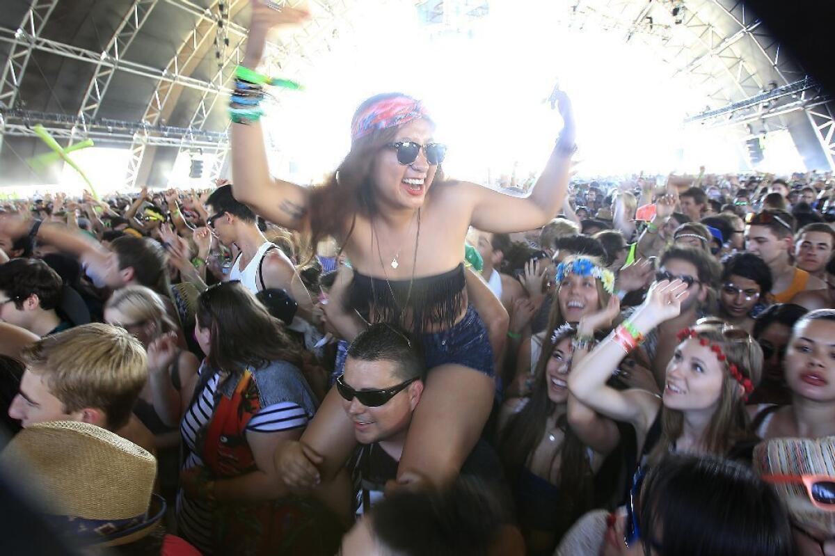 Festival goers enjoy "Harlem Shake" DJ Baauer at the Coachella Music and Arts Festival.