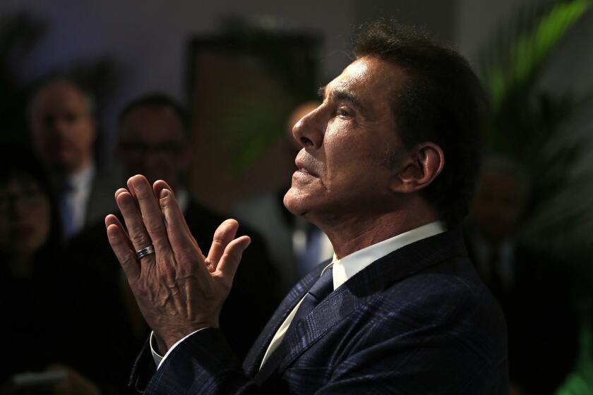 FILE - In this March 15, 2016, file photo, former Las Vegas casino mogul Steve Wynn gestures during a news conference in Medford, Mass. Wynn won a battle in a legal fight about whether Nevada gambling regulators can fine him over allegations of workplace sexual misconduct even though he no longer is licensed or involved in the gambling industry. A Wynn attorney declined Monday, Nov. 23, 2020, to comment about a state court judge's finding that because Wynn has no ties to the casino business, the state Gaming Commission and Gaming Control Board have no jurisdiction over him. (AP Photo/Charles Krupa, File)