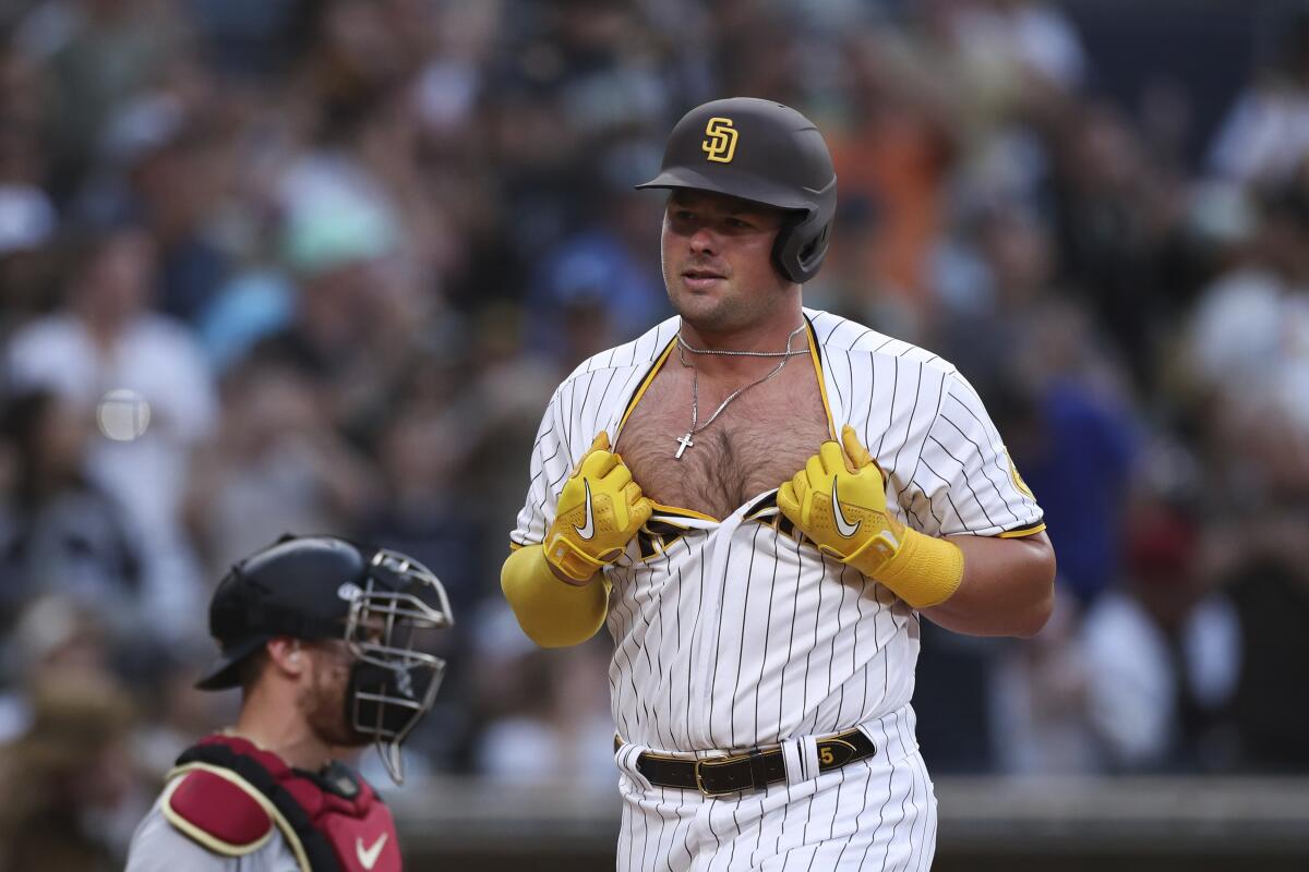 Padres designated hitter Luke Voit celebrates as he crosses the plate following his three-run homer in the sixth inning.