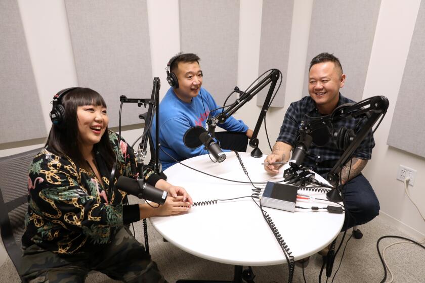 EL SEGUNDO, CALIF. -- MONDAY, DECEMBER 9, 2019: Los Angeles Times reporters Jen Yamato, left to right, and Frank Shyong with Jet Tilakamonkul, also known Jet Tila, an American celebrity chef and restaurateur. He is currently the chef of The Charleston and Pakpao Thai. Photo taken at Los Angeles Times office, in El Segundo, Calif., on Dec. 9, 2019. (Gary Coronado / Los Angeles Times)
