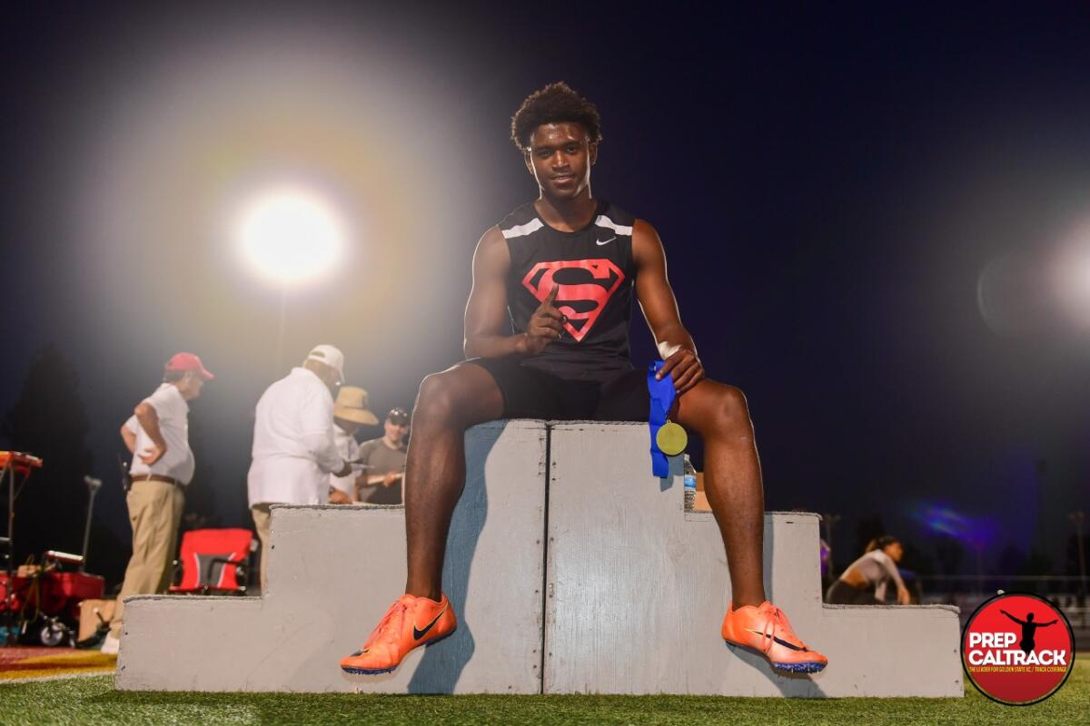 Rodrick Pleasant of Gardena Serra showing off his medal at Arcadia High track meet.