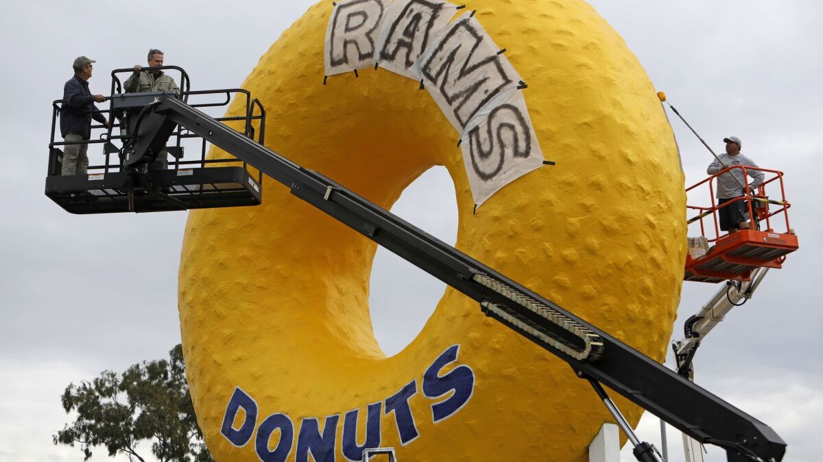Randy's Donuts iconic sign gets a Rams-themed makeover in Inglewood, Calif. The sign, which is visible to all air passengers as they land and as they leave LAX via the 405 Freeway.