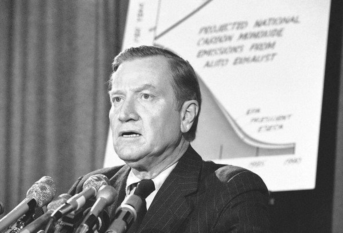 Russell Train, shown speaking at a news conference in 1975, led the Environmental Protection Agency from 1973 to 1977. In 1991, he was awarded the Presidential Medal of Freedom, the nation's highest civilian honor.