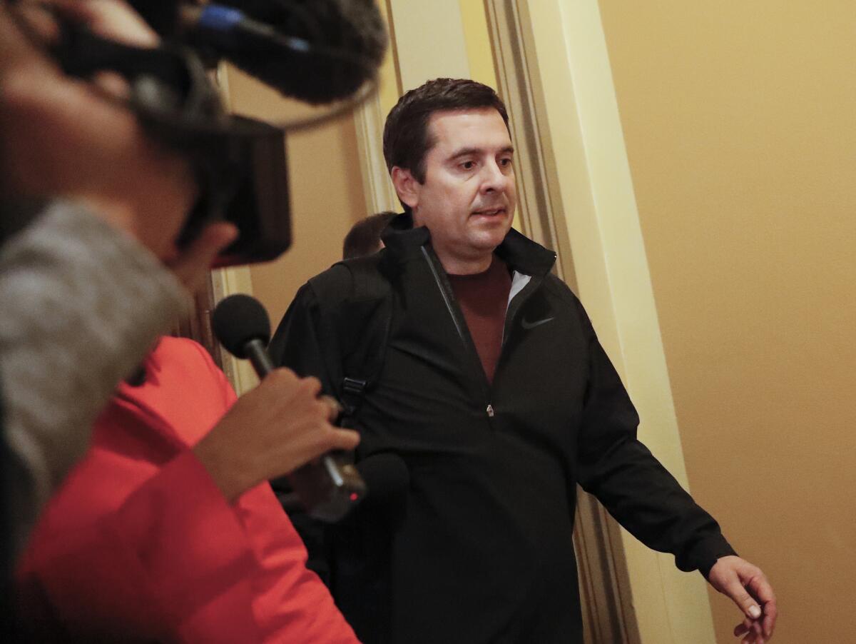 House Intelligence Committee Chairman Rep. Devin Nunes (R-Tulare) is pursued by reporters as he leaves Capitol Hill on April 6.