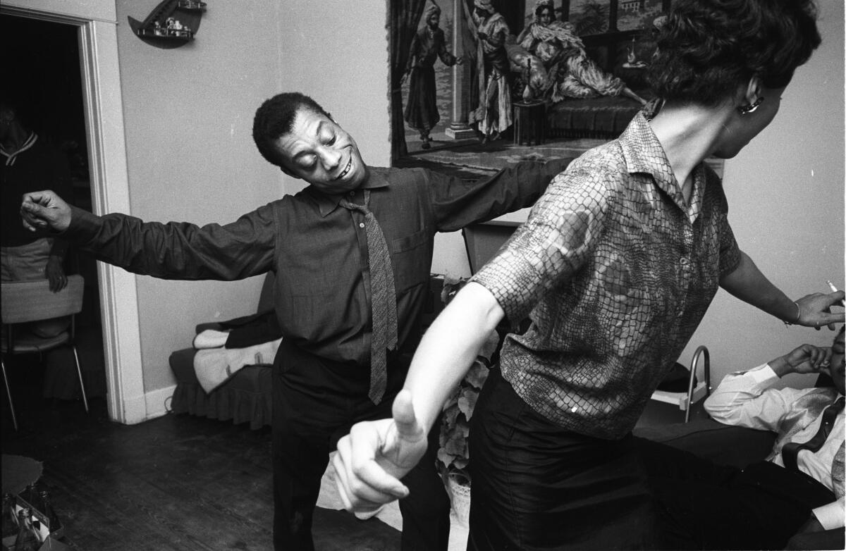 A black-and-white image of two people dancing.