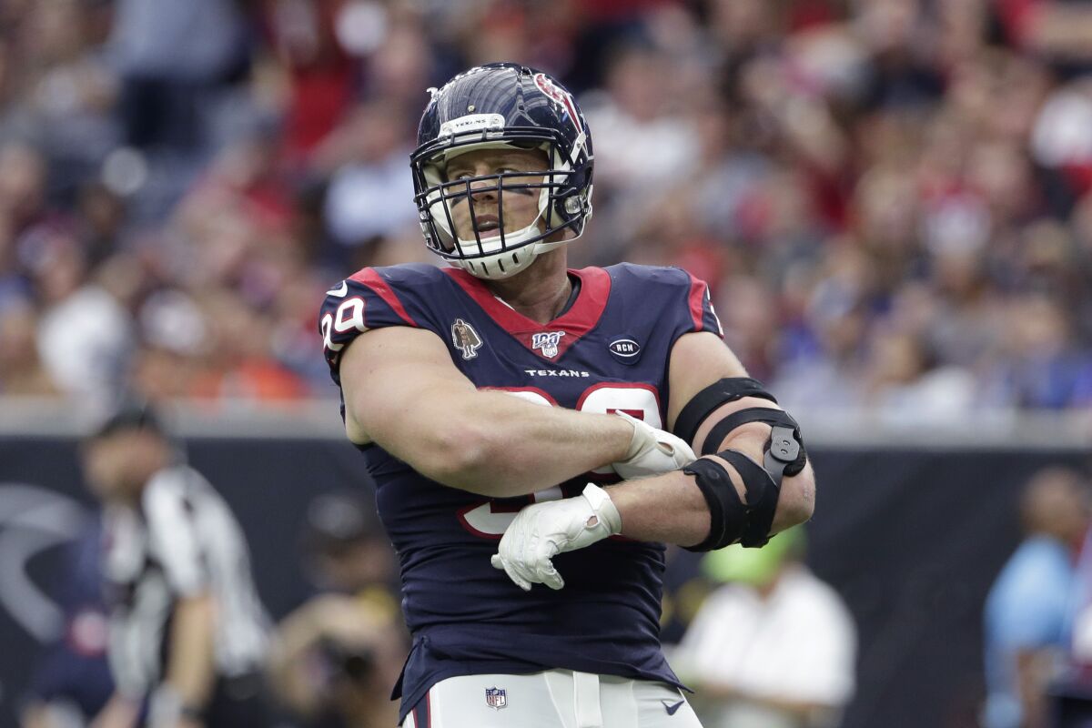 Houston Texans defensive end J.J. Watt reacts after a play against the Oakland Raiders on Sunday.