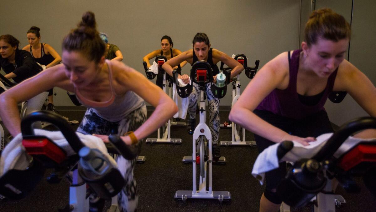 LOS ANGELES, Dec. 14, 2016 - Participants enjoy the EvolvRide class Dec. 13, 2016 at Evolvcycle which is a new family run spinning studio in Studio City. It is quite elegant with brand new computerized Schwinn bikes, George Nelson bubble lamps, showers and eucalyptus towels after class. Get a wide variety of pictures of the class, details, the space(Barbara Davidson/Los Angeles Times)