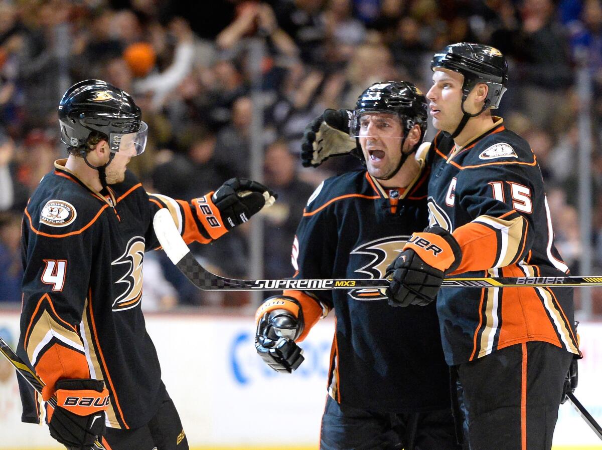 Francois Beauchemin, center, celebrates after scoring a power-play goal in the third period against the Rangers on Wednesday during the Ducks' 4-1 loss to New York.