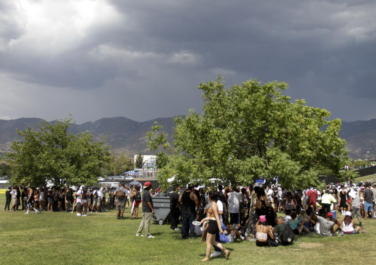 SAN BERNADINO, CA SEP. 07, 2013. The dark cloud drifted over the park gave heat relief to festival goers on day one of Rock The Bells at San Manuel Amphitheatre in San Bernardino on Sep. 7, 2013. Day one of Rock The Bells, a two days festival of hip hop performances. (Lawrence K. Ho/Los Angeles Times)..