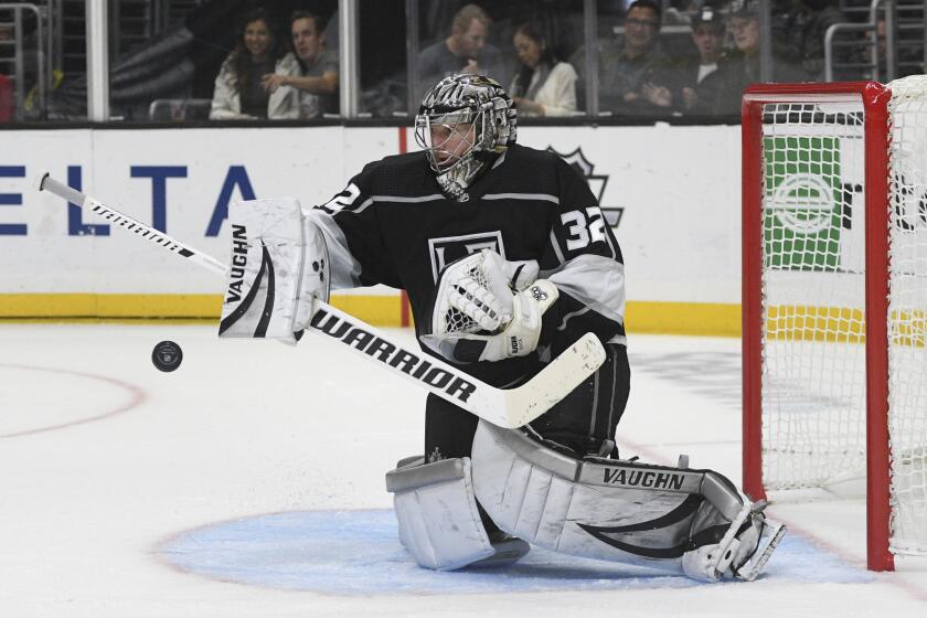 Los Angeles Kings goalie Jonathan Quick blocks a shot by the Detroit Red Wings during the third period of an NHL hockey game, Thursday, Nov. 14, 2019, in Los Angeles. The Kings won 3-2. (AP Photo/Michael Owen Baker)
