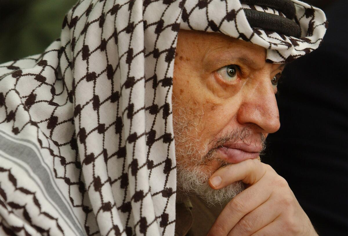 Palestinian leader Yasser Arafat attends Friday prayers May 17, 2002 at his headquarters in the West Bank town of Ramallah.