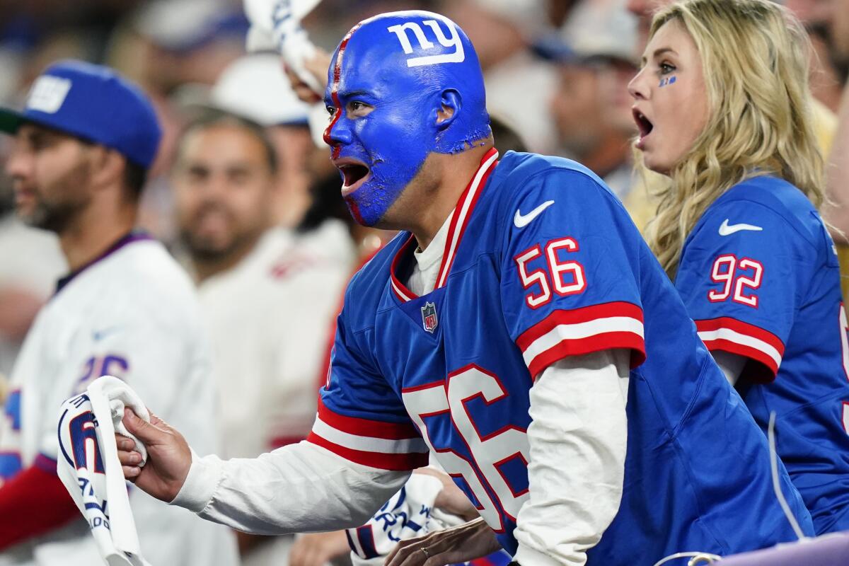 New York Giants fans cheer during the fourth quarter of an NFL football game