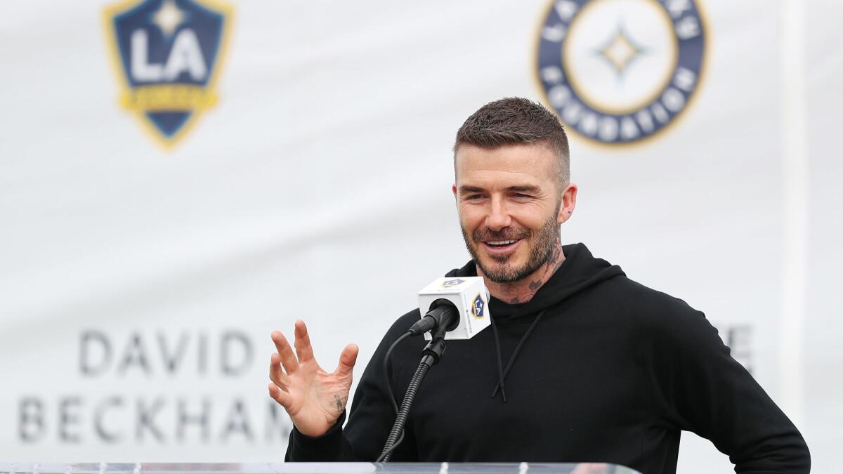 David Beckham addresses the crowd during the unveiling of a community soccer field at The Salvation Army Red Shield Youth & Community Center on Friday in Los Angeles.